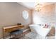 Bathroom includes a standalone tub, mosaic tile wall and modern vanity with unique mirror at 529 Langley Rd, Lancaster, SC 29720