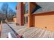 Large wooden deck with space for seating and entertaining, attached to a light orange-colored home with arched windows at 529 Langley Rd, Lancaster, SC 29720