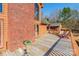 A spacious wooden deck featuring outdoor seating and access to an orange-colored home with a brick facade at 529 Langley Rd, Lancaster, SC 29720