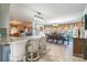 Well-lit dining room area featuring tiled floors, barstool seating and a bay window at 529 Langley Rd, Lancaster, SC 29720