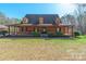 Inviting home with a cozy, covered porch and well-manicured front yard at 529 Langley Rd, Lancaster, SC 29720