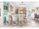 Bright eat-in kitchen with white cabinets, granite countertops, and counter seating at 529 Langley Rd, Lancaster, SC 29720
