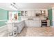 Spacious kitchen featuring white cabinetry, stainless appliances, and subway tile backsplash at 529 Langley Rd, Lancaster, SC 29720