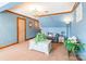 Living room featuring blue walls, wood trim, carpeting, chandelier, and comfortable seating at 529 Langley Rd, Lancaster, SC 29720