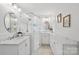 Modern bathroom features dual vanity sinks and a glass-enclosed walk-in shower at 545 Dilworth Mews Ct, Charlotte, NC 28203