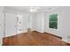 Empty bedroom with hardwood floors, natural light, and an ensuite bathroom at 545 Dilworth Mews Ct, Charlotte, NC 28203