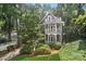 Stately home with tiered balconies surrounded by lush greenery at 545 Dilworth Mews Ct, Charlotte, NC 28203