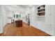 Bright kitchen with stainless steel appliances, white cabinets, hardwood floors, and an island with seating at 545 Dilworth Mews Ct, Charlotte, NC 28203