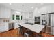 Modern kitchen with a large island, stainless steel appliances, and white cabinetry offering ample storage at 545 Dilworth Mews Ct, Charlotte, NC 28203