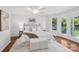Bright primary bedroom boasts a walkout balcony and hardwood floors at 545 Dilworth Mews Ct, Charlotte, NC 28203