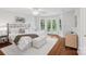 Bright main bedroom boasts private balcony access and neutral color palette at 545 Dilworth Mews Ct, Charlotte, NC 28203