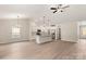 Bright, open-concept living space featuring light wood floors and a modern kitchen island at 5621 Skinny Dr, Charlotte, NC 28215