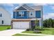 Charming two-story home with a stone-accented facade and a well-manicured lawn at 5626 Skinny Dr, Charlotte, NC 28215