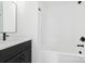 Clean bathroom featuring new fixtures, a tub and shower combination, and neutral walls at 600 Legrand St, Shelby, NC 28150