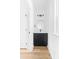 Stylish half bathroom with a black vanity, mirror, and new lighting at 600 Legrand St, Shelby, NC 28150