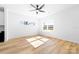 Bright bedroom with hardwood floors, ceiling fan, and natural light from a double window at 600 Legrand St, Shelby, NC 28150