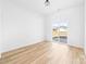 Bright bedroom featuring a sliding glass door and luxury vinyl flooring at 600 Legrand St, Shelby, NC 28150