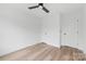 Bright bedroom featuring neutral walls, wood-look floors, and a modern ceiling fan at 600 Legrand St, Shelby, NC 28150