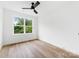 Bright bedroom featuring neutral walls, wood-look floors, and a modern ceiling fan at 600 Legrand St, Shelby, NC 28150