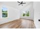 Bedroom featuring wood-look floors, neutral walls, new windows, and lots of natural light at 600 Legrand St, Shelby, NC 28150