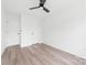 Bright bedroom featuring neutral walls, wood-look floors, and a modern ceiling fan at 600 Legrand St, Shelby, NC 28150