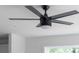 Sleek, black ceiling fan with five blades and a globe light fixture adds modern elegance to the room at 600 Legrand St, Shelby, NC 28150