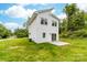 Side view of a two-story home with a sliding glass door leading to a concrete patio at 600 Legrand St, Shelby, NC 28150