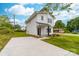 Charming two-story home featuring a crisp white exterior, black accents, and a well-manicured lawn at 600 Legrand St, Shelby, NC 28150