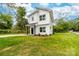 Charming two-story home featuring a crisp white exterior, black accents, and a well-manicured lawn at 600 Legrand St, Shelby, NC 28150