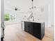 Kitchen with a black island, stainless steel dishwasher, and eat-in bar at 600 Legrand St, Shelby, NC 28150