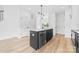 Kitchen island features a black sink and dishwasher with white countertop at 600 Legrand St, Shelby, NC 28150