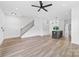Bright and open living room with modern flooring, staircase and open access to kitchen at 600 Legrand St, Shelby, NC 28150