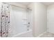 Bright bathroom featuring a shower-tub combo and patterned shower curtain at 6048 Chelsea Oaks Rdg, Tega Cay, SC 29708