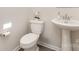 Bathroom featuring a pedestal sink, toilet, and neutral decor at 6048 Chelsea Oaks Rdg, Tega Cay, SC 29708