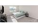 Sun-lit bedroom with a large window and neutral carpet at 6048 Chelsea Oaks Rdg, Tega Cay, SC 29708