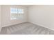 Spacious bedroom featuring a double window and plush carpeting at 6048 Chelsea Oaks Rdg, Tega Cay, SC 29708