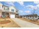 New townhome with brick and siding, a driveway and a one-car garage at 6048 Chelsea Oaks Rdg, Tega Cay, SC 29708