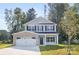 Charming two-story home with a brick-accented garage and beautifully landscaped front yard at 6217 Rockwell W Blvd, Charlotte, NC 28269