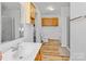 Bright bathroom featuring vanity with sink, tile flooring, toilet, shower, and storage cabinets at 705 Sagrada Dr, York, SC 29745