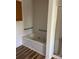 Clean bathroom featuring a large soaking tub with chrome fixtures and grab bars for assistance at 705 Sagrada Dr, York, SC 29745