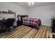 Bedroom showcasing laminate floors, a ceiling fan, and ample space for a desk at 705 Sagrada Dr, York, SC 29745