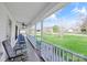Inviting front porch with rocking chairs overlooking the lawn, perfect for relaxing at 705 Sagrada Dr, York, SC 29745