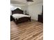 Elegant bedroom with hardwood floors, complemented by ornate furniture, and soft, natural light at 705 Sagrada Dr, York, SC 29745