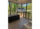 Enclosed porch with wood trim, lounge furniture and an outside view at 705 Sagrada Dr, York, SC 29745