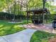 Backyard with a patio, fire pit, and outdoor seating, perfect for entertaining at 7417 Shadowlake Dr, Charlotte, NC 28226