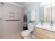 Modern bathroom featuring tiled shower, updated vanity, and sleek fixtures at 7417 Shadowlake Dr, Charlotte, NC 28226