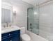 Modern bathroom with glass shower doors, vanity, and updated fixtures at 7417 Shadowlake Dr, Charlotte, NC 28226