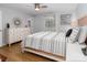Bright bedroom featuring stylish decor, natural light, and hardwood floors at 7417 Shadowlake Dr, Charlotte, NC 28226