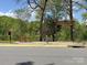 Shadow Lake community sign, bench, and picturesque lake views at 7417 Shadowlake Dr, Charlotte, NC 28226