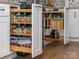 Modern kitchen cabinets feature pull out shelving, spice racks, and storage for kitchen utensils and supplies at 7417 Shadowlake Dr, Charlotte, NC 28226